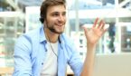 A photo of smiling contact centre advisor making a point