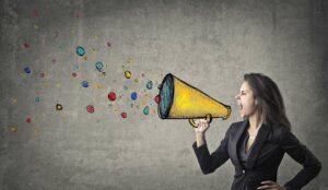 A picture of a woman shouting down a megaphone