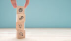 A photo of blocks being stacked with strategy symbols