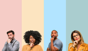 4 people looking thoughtful on a colourful background