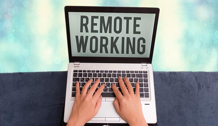 A picture of a laptop with the words remote working