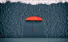 A red umbrella is sourounded by drawings of rain falling from a cloud