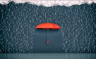 A red umbrella is sourounded by drawings of rain falling from a cloud