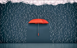 A red umbrella is sourounded by drawings of rain falling from a cloud