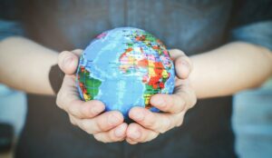 A photo of a globe in someone's hands