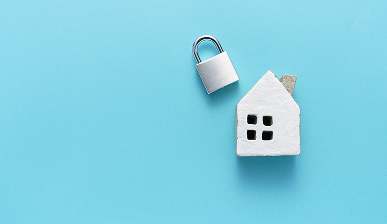 A picture of a house and a padlock