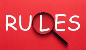 A picture of the word "rules" on a red background