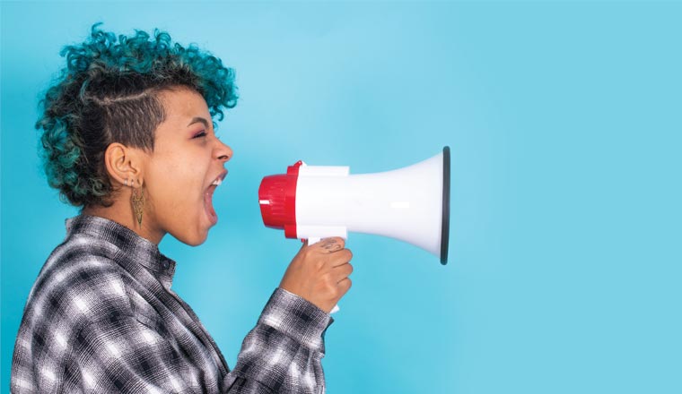 A picture of a person shouting into a megaphone