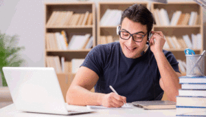 man wearing headset happilyworking from home