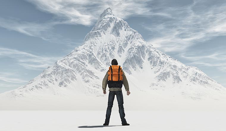 A photo of a man versus a mountain