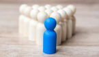 A picture of a blue figurine leading a group