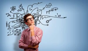 A picture of a person thinking with sketched ideas in the background