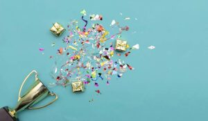 A photo of a trophy filled with confetti