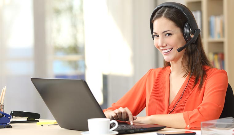 A picture of an customer service agent working from home office