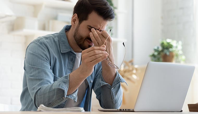 A photo of a fatigued remote worker