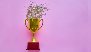 A photo of a trophy with gold confetti