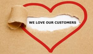 A picture of a heart with the words we love our customers
