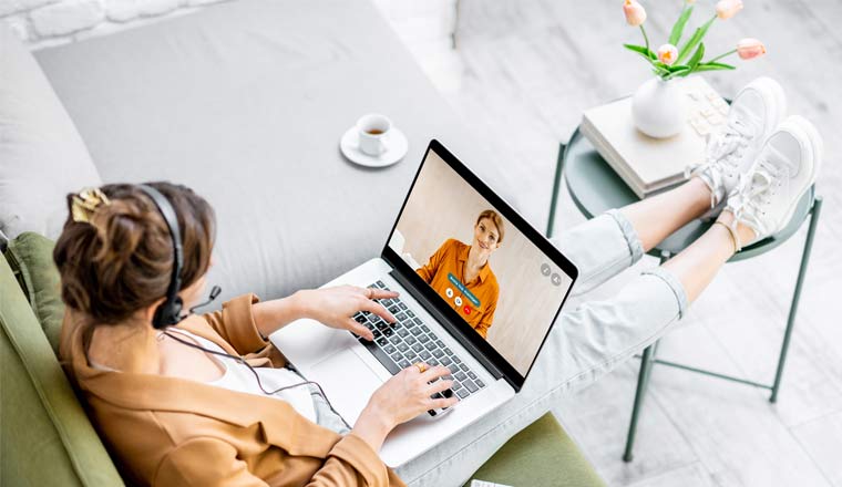 A picture of an agent working from home on laptop