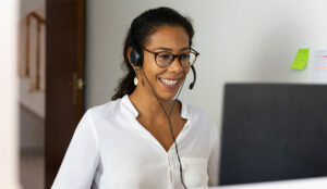 A picture of an agent smiling on a video call