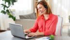 A picture of an agent wearing a headset at home office