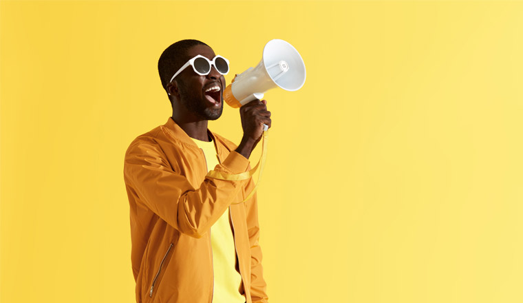 A picture of a man shouting into a megaphone