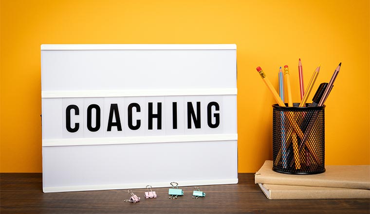 A photo of a coaching sign