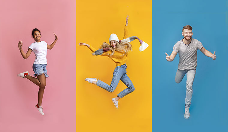 A photo of happy people jumping