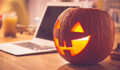 A photo of a pumpkin on someone's desk