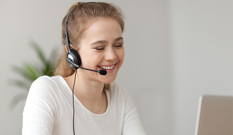 A photo of a smiling remote agent