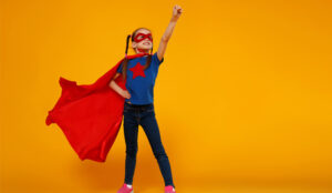 A picture of a super hero wearing a cape