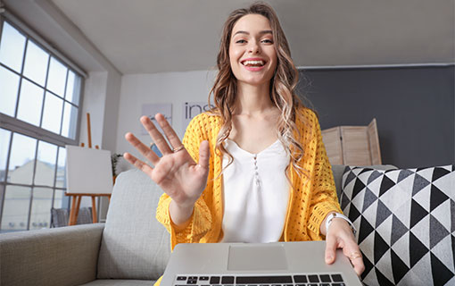 A photo of someone waving into a video cam