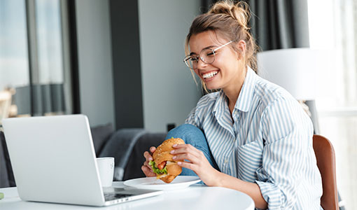 A photo of someone eating a burger online webcam