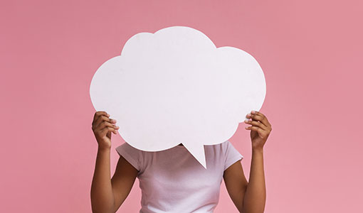 A photo of someone holding a speech bubble