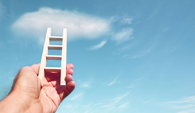 A photo of someone holding a ladder to the cloud
