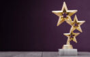 3 gold stars on an award trophy