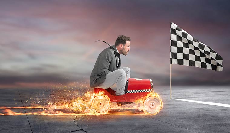 A photo of a business person racing on a cart