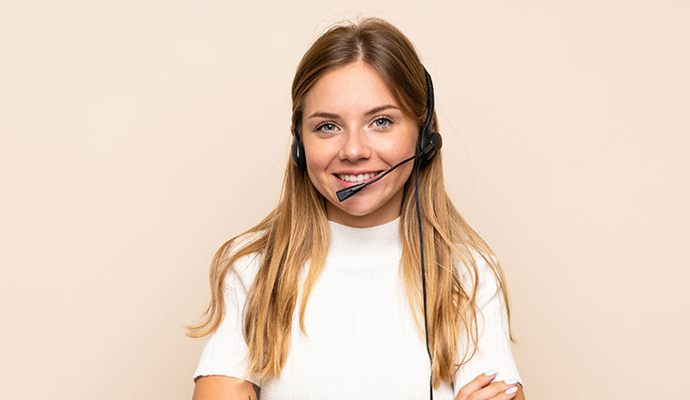 A picture of a customer service agent smiling