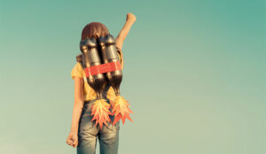 A photo of a kid playing with a jetpack