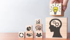 A picture of wooden blocks with business icons
