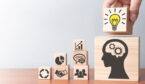 A picture of wooden blocks with business icons