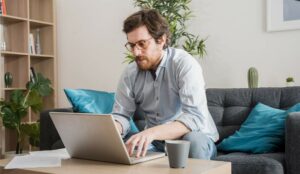 A picture of an agent working at home with laptop