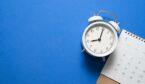 A photo of a clock on a calnedar