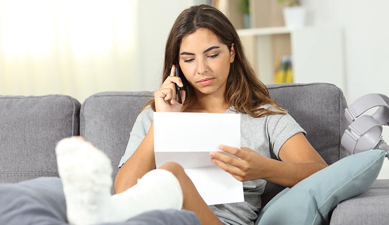 A photo of a disabled person making a phone call