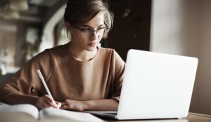 A photo of someone working at their laptop