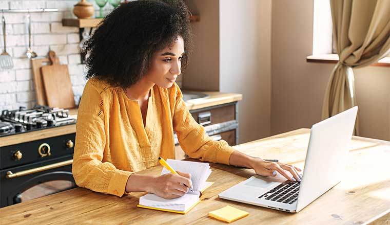 A photo of someone working at their laptop