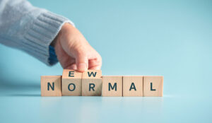 An image of blocks with the letters "new normal"