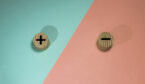 A picture of a plus and minus on wooden buttons