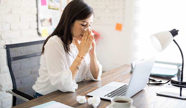 A photo of a sick person at work