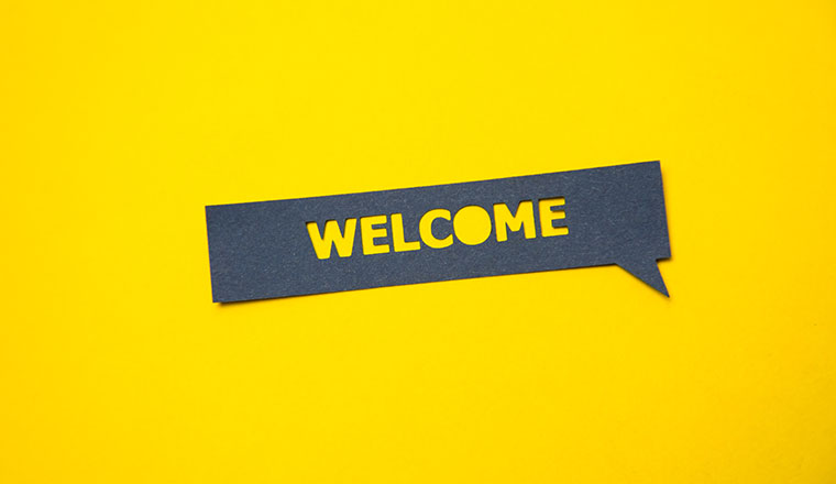A photo of a "welcome" speech bubble