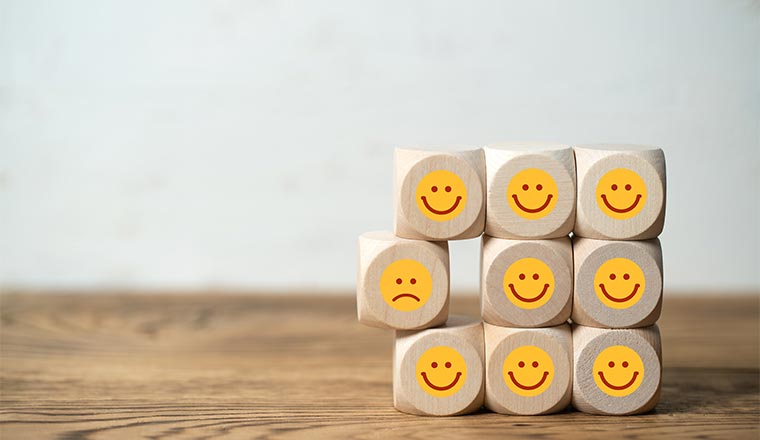 A photo of happy and unhappy dice